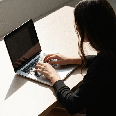 Person using a laptop to securely browse the internet with a clean desk background